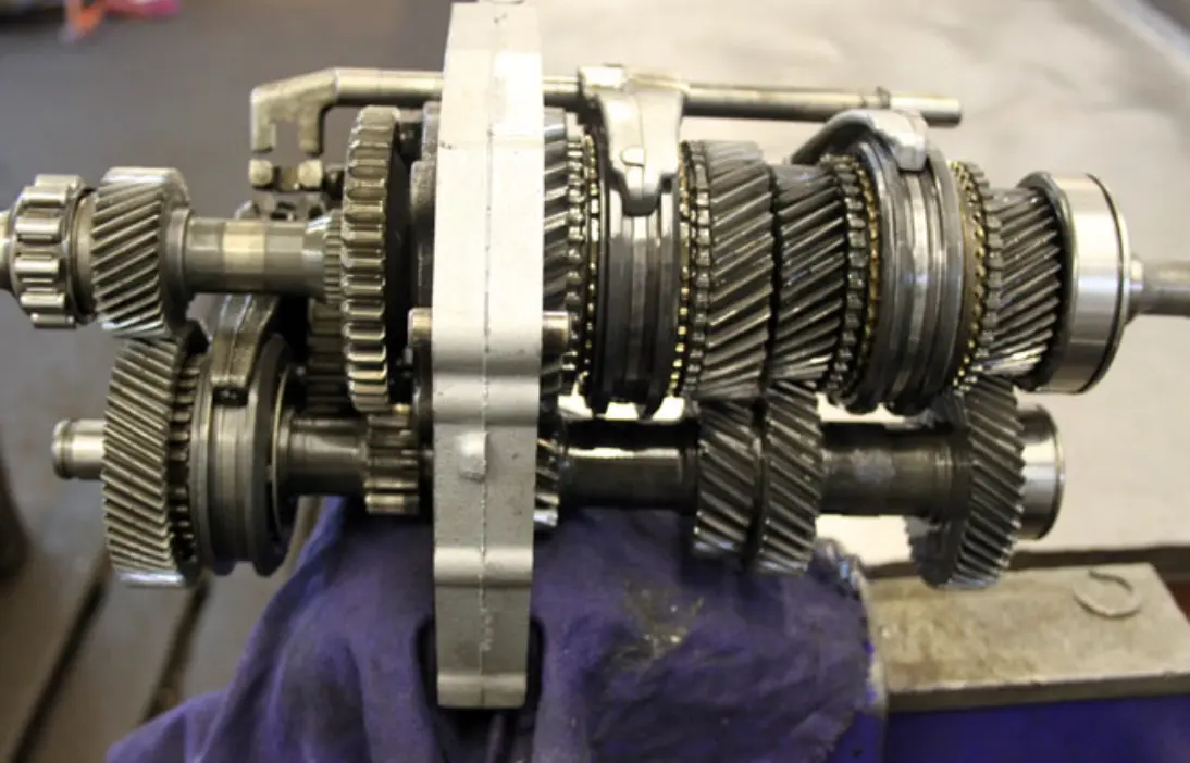 Gearbox drive assembly opened on a workbench